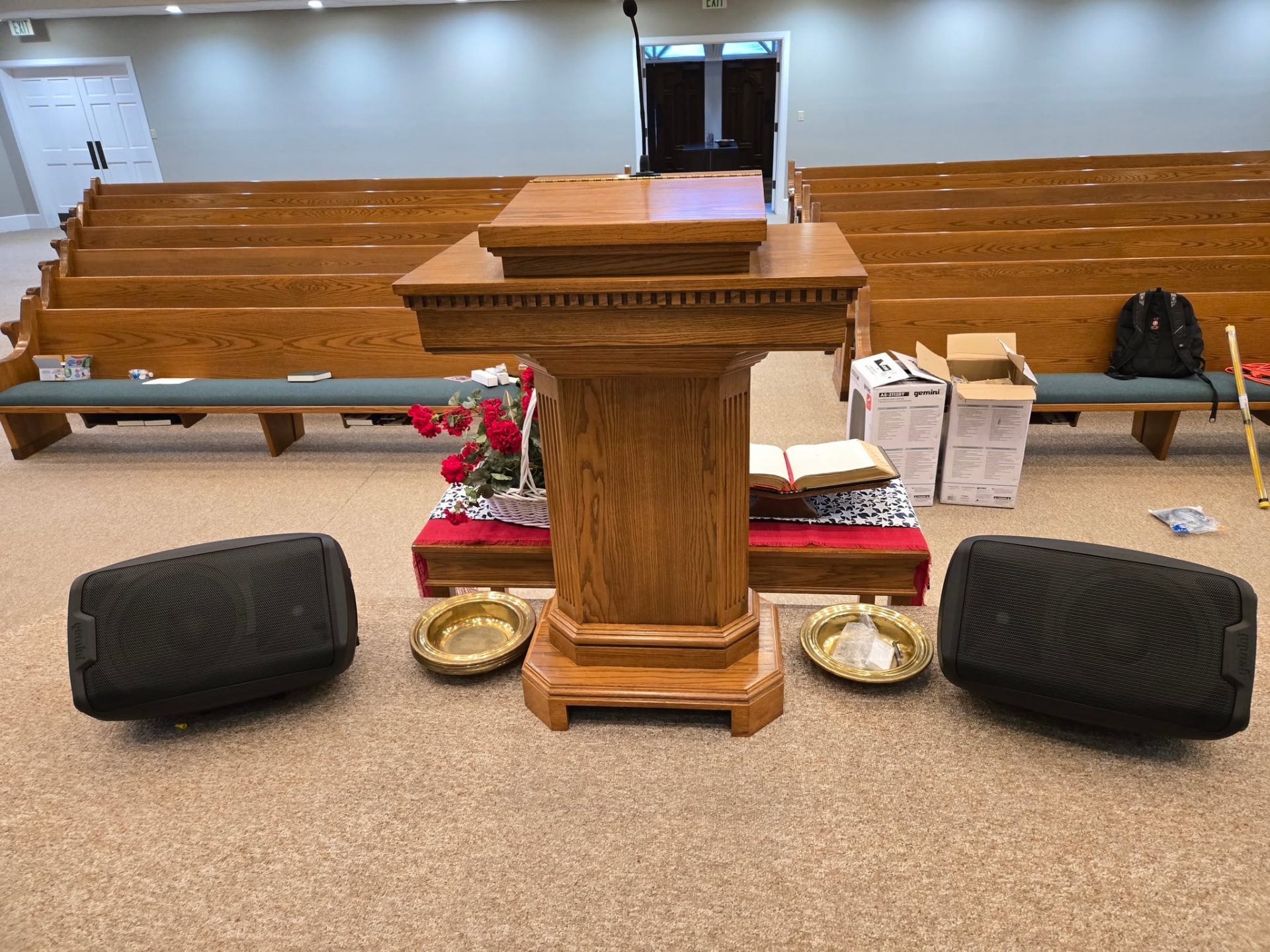 Portable speakers installed beside a church pulpit in Chickasaw County