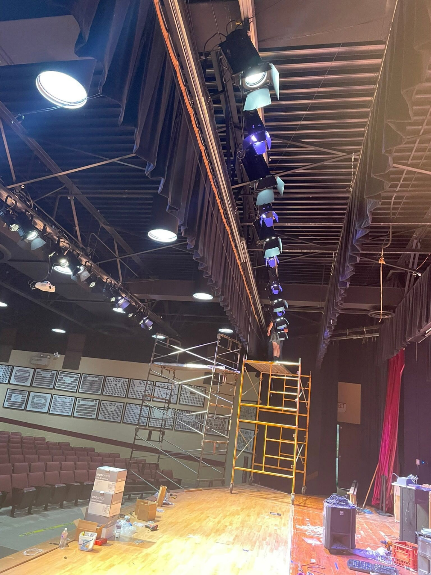 Stage lighting installation underway in a Chickasaw County auditorium